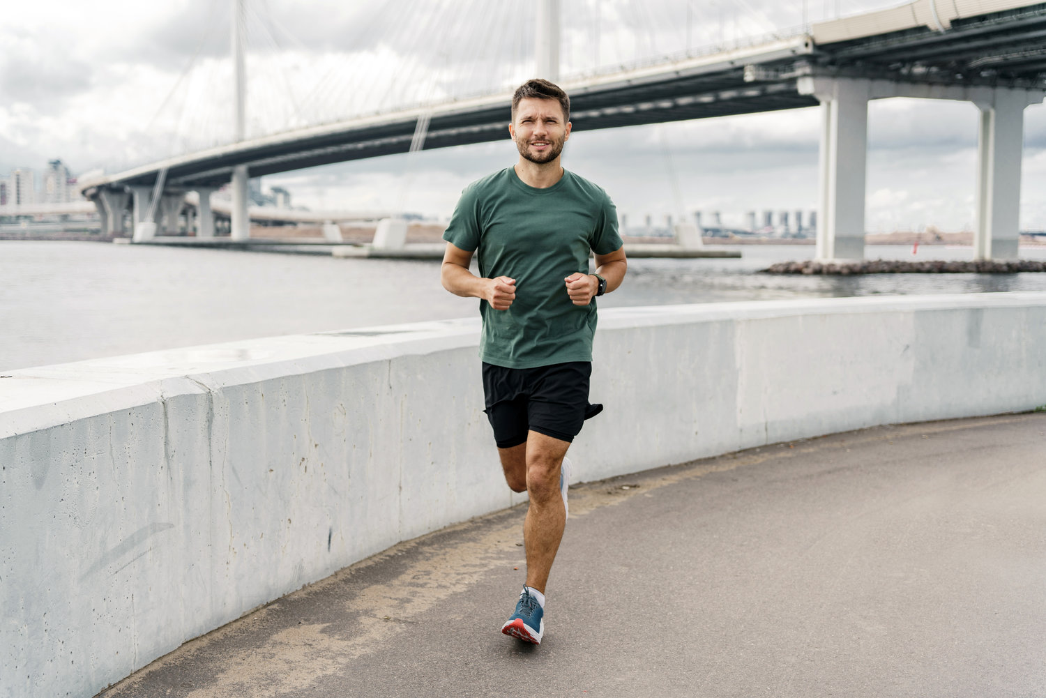 Male runner jogging in fitness clothes. Motivation and stimulation of fitness exercises. Athlete by interval one workout. Sports man outdoor sports.