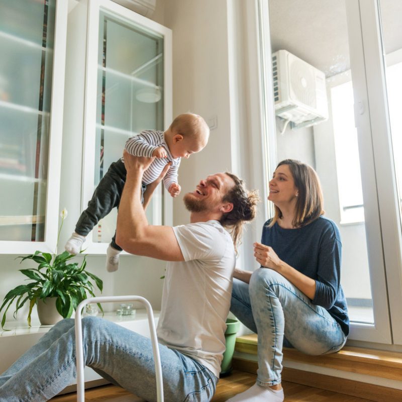 Young parents playing with baby