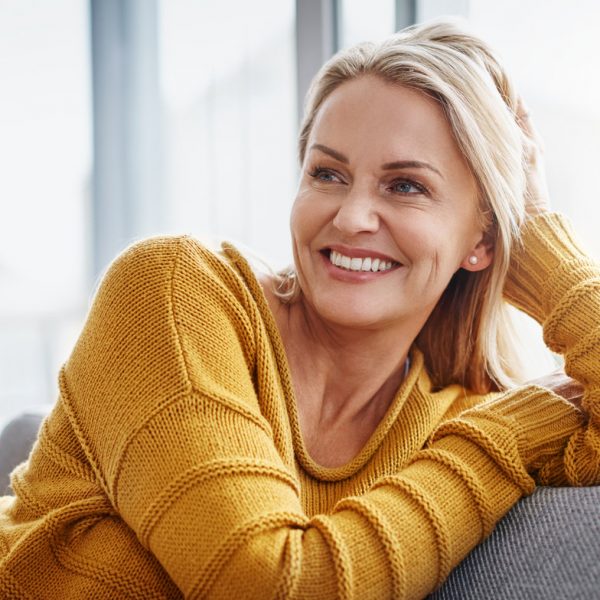 Shot of an attractive mature woman relaxing on the sofa at home.